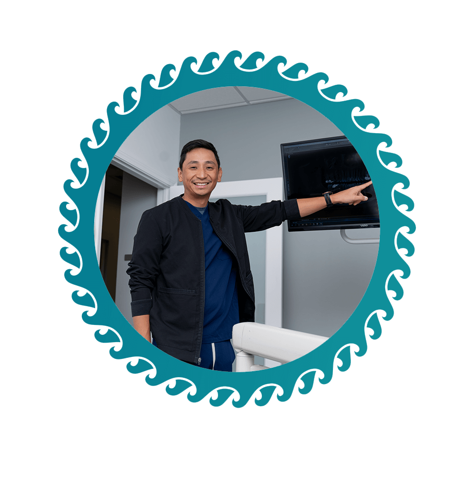 doctor going over dental procedure information with patient within the dental center