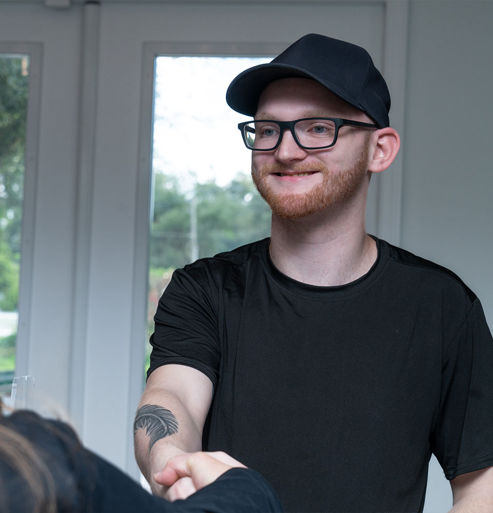 patient being helped at the front desk of the dental center