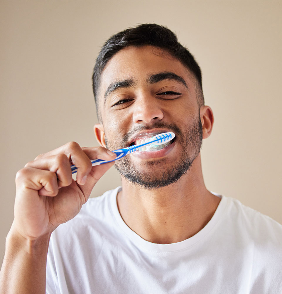 person brushing their teeth