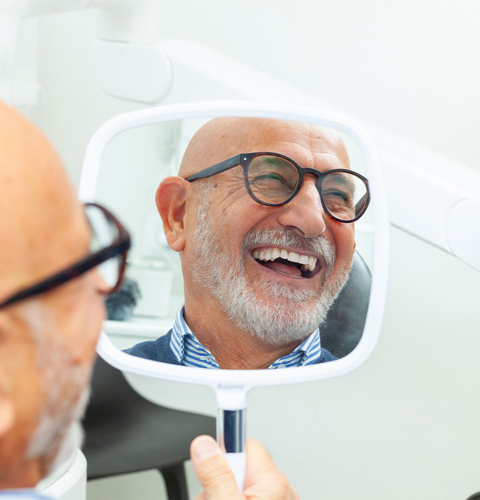 dental patient smiling brightly after their dental procedure