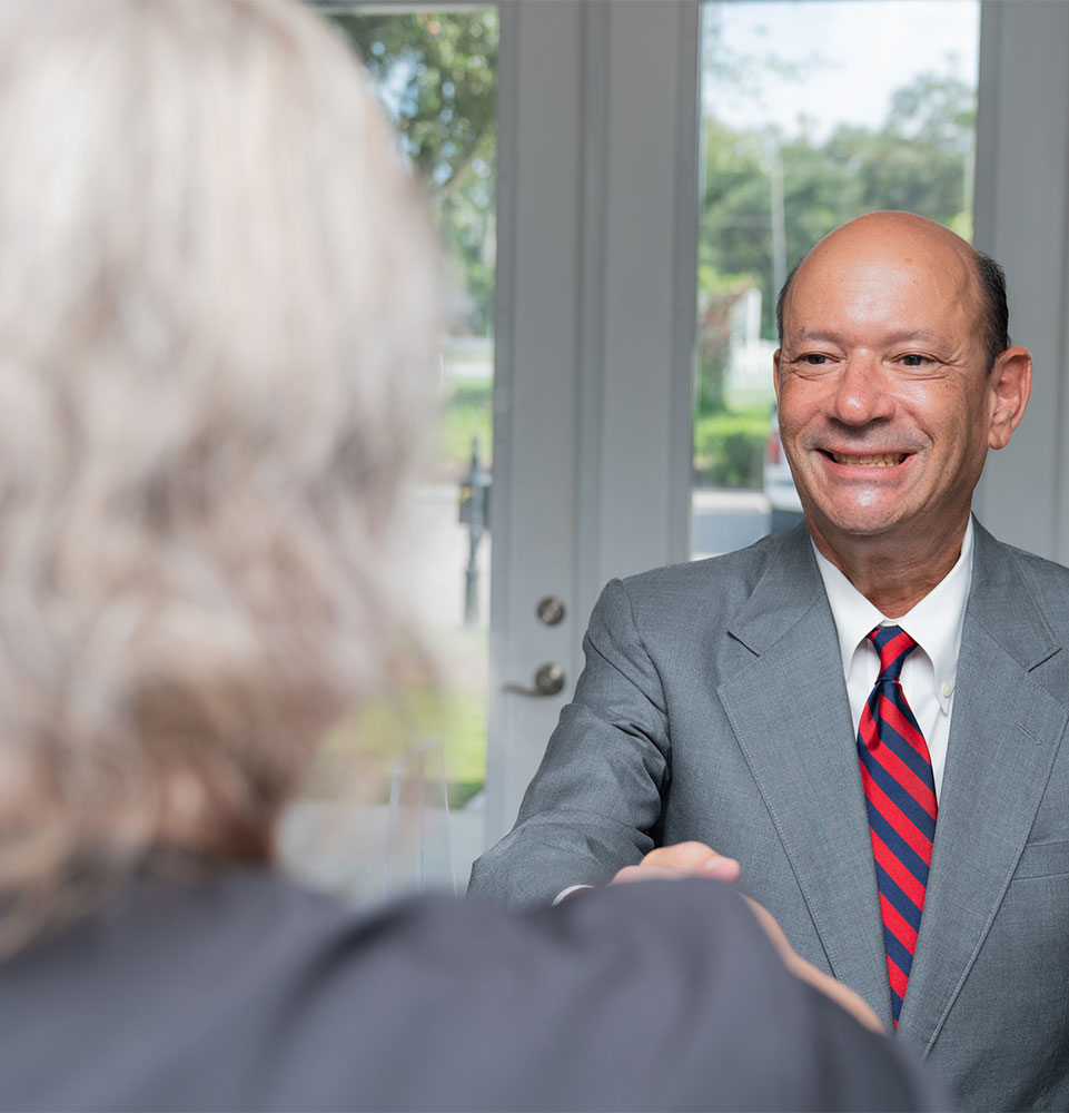 patient being greeted at the front desk of the dental center
