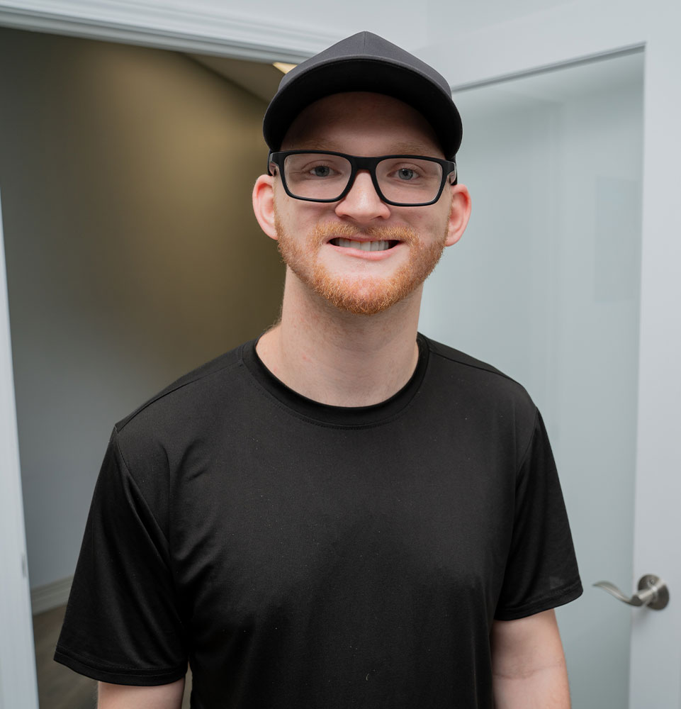 headshot of patient smiling brightly after their dental procedure