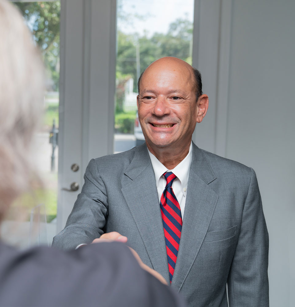 patient being helped at the front desk of the dental practice