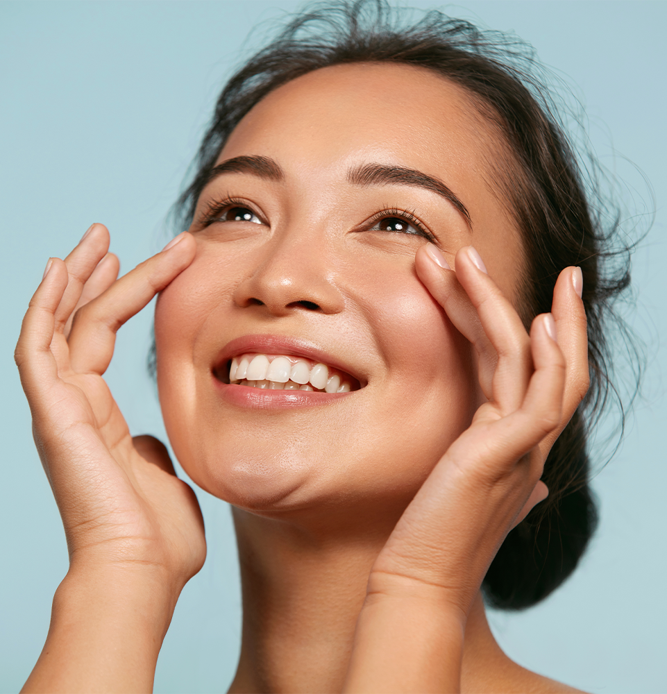 Woman with beauty face touching healthy facial skin portrait. Beautiful smiling