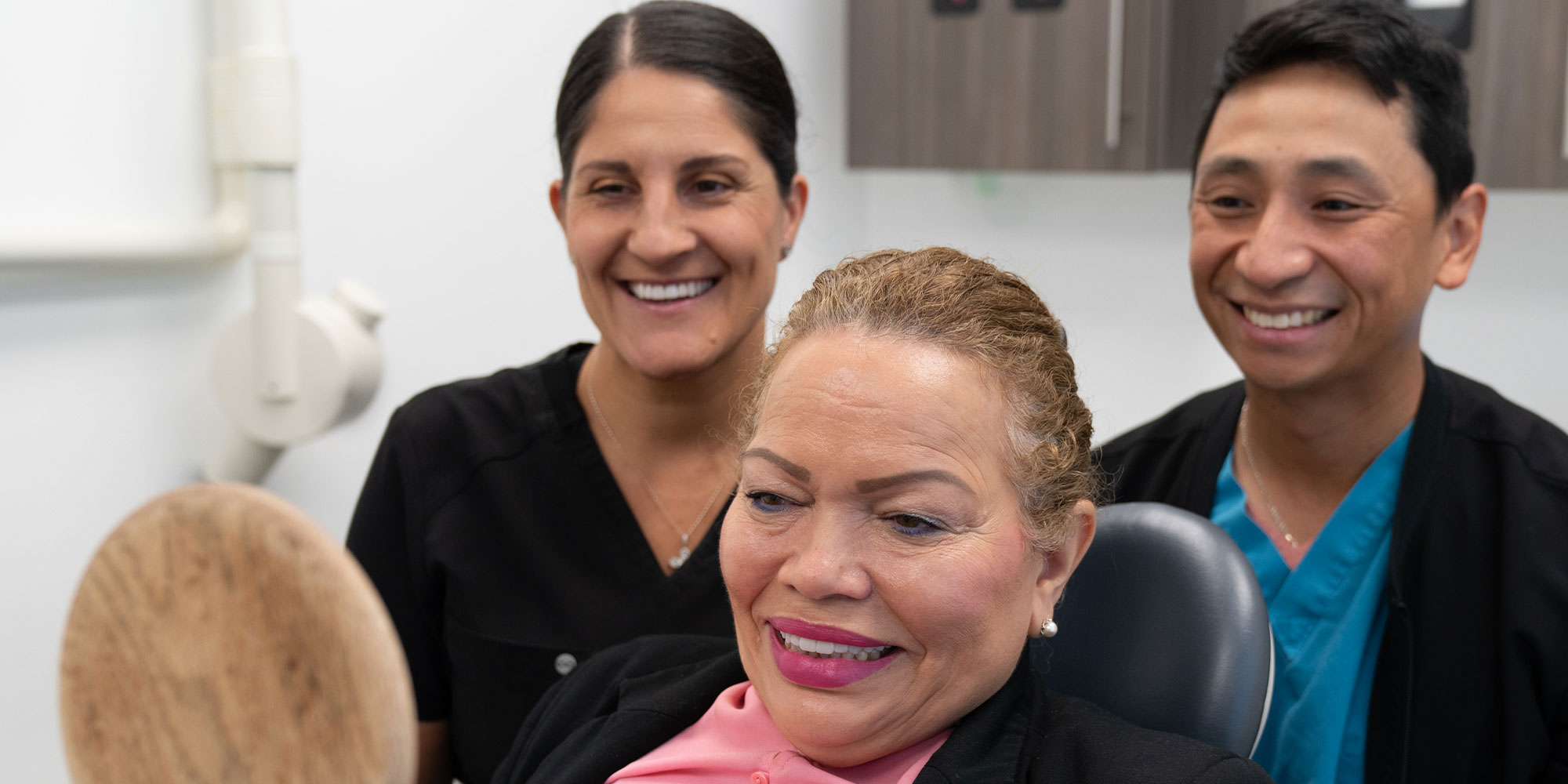 Patient looking into Mirror smiling